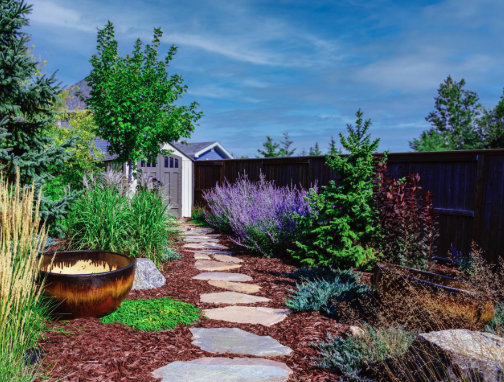 Beautiful garden pathway with trees and flowering plants