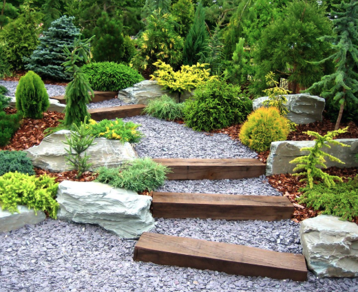 Beautiful garden design with stone steps and gravel pathways